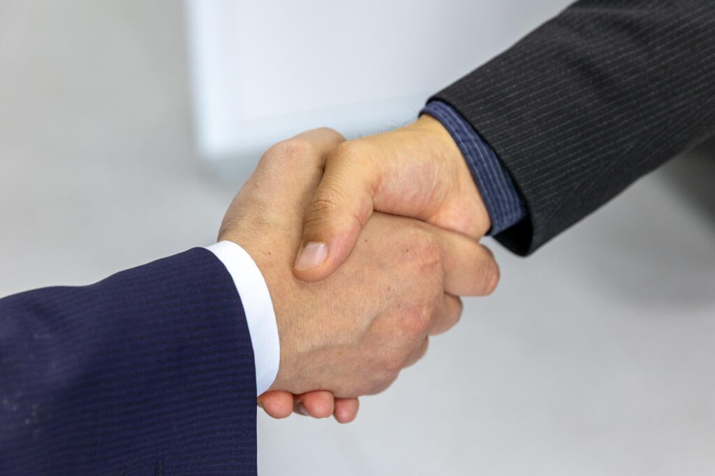 Professional handshake symbolizing trust and client relationships